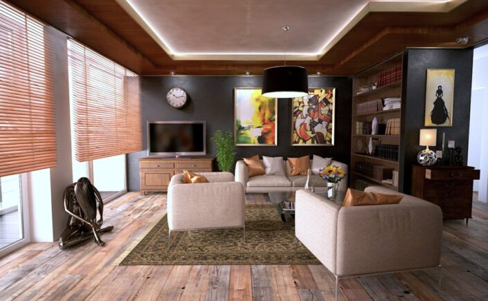 Sun-drenched modern living room with large windows, comfortable minimalist furniture, and green plants, creating a sense o...